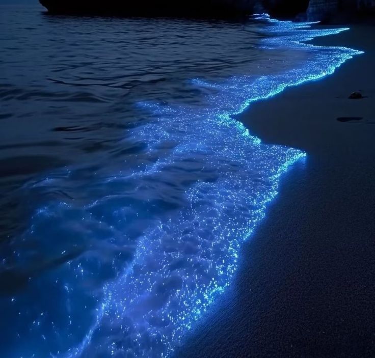 A photo of glowing water at the beach.